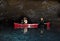 Man and Woman Photographing inside Lava Tube Lake Cave