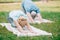 Man and woman practicing relaxation yoga poses on yoga mats