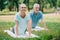 Man and woman practicing relaxation yoga poses on yoga mats