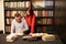 A man and a woman read educational books in the library