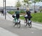 A man and a woman rented bikes for chatting and Cycling in the city