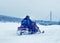Man and woman riding snowmobile at winter Rovaniemi