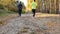 Man and woman running on the autumn woods