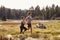 Man and woman running in nature near a lake, close up