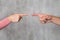 Man and woman`s fingers pointing at each other