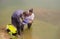 Man and woman scientist ecologist taking samples of water