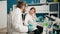 Man and woman scientists working at laboratory