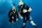 Man and woman scuba dive togeather