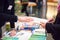 Man and Woman Sharing Information Leaflet over Exhibition Stand