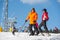 Man and woman skiers with skis at winter resort