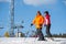 Man and woman skiers with skis at winter resort