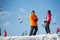 Man and woman skiers with skis at winter resort