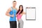 Man and woman in sportswear posing with a clipboard