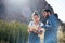 Man and woman standing in the desert next cactus