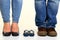 Man and woman standing with little boys shoes stock photo