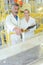 Man and woman stood on gangway observing factory