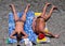 Man and woman are sunbathing lying on the beach