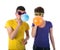 Man and woman with sunglasses blowing balloons