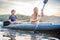 Man and woman swims on kayak in the sea on background of island. Kayaking concept.Kayaking concept with family of father