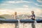 Man and woman swims on kayak in the sea on background of island. Kayaking concept.Kayaking concept with family of father