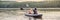 Man and woman swims on kayak in the sea on background of island. Kayaking concept.Kayaking concept with family of father