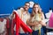 Man and woman tailors holding t shirt looking clothing design at clothing factory