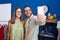 Man and woman tailors smiling confident make selfie by smartphone at clothing factory