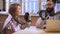 Man and woman talk on radio, record podcast about business in office with mic laptop. Two