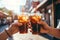 Man and woman toasting with plastic takeaway cups of delicious iced coffee outdoors