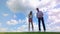 Man and woman training, playing golf at a course.