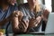 Man and woman using smartphones discussing mobile apps, close up