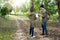 Man and woman walk in the forest