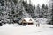 Man and woman walk in a winter snow scene