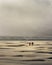 Man and Woman walking on Agate Beach, Oregon