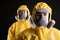 Man and woman wearing chemical protective suits on background. Virus research