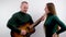 man and woman on white background romance love Serenade man tunes guitar Music lesson teacher explains advertising music