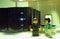 A man and a woman working in a data processing center, diorama recreated the concept with lego figures