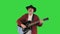 Man of the woods with acoustic guitar singing a song on a Green Screen, Chroma Key.