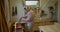 a man woodworker working in his tiny workshop on a jointing machine