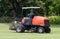 Man work gardener riding mower machine in golf course.