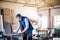 A man worker in the carpentry workshop, working with wood.