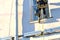 The man worker climbing at construction site with helmet and uniform for works .