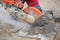 Man worker cutting concrete circular tool diamond blade