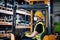 Man worker forklift driver with protective mask working in industrial factory or warehouse.