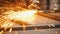 Man worker grinding the seams of an iron frame in the workshop - the sparkles