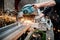 Man, worker using a sliding compound mitre saw