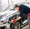 Man worker washing luxury car