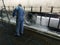 Man worker washing a semi trailer