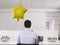 Man Working Alone Beside Balloon In Office