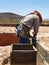 Man Working on Excavation Site - Vertical